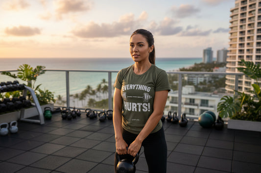 Green t-shirt with 'Everything Hurts! Gym Life' text and barbell graphic.