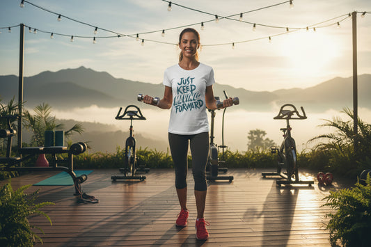 White t-shirt with 'Just Keep Moving Forward' text in blue with a gym scenic background.