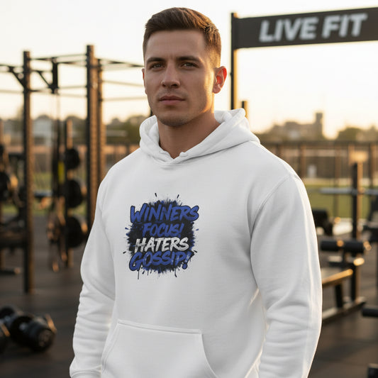 Man wearing a white hoodie with Winners Focus Haters Gossip! text at a fitness facility with a LIVE FIT sign.
