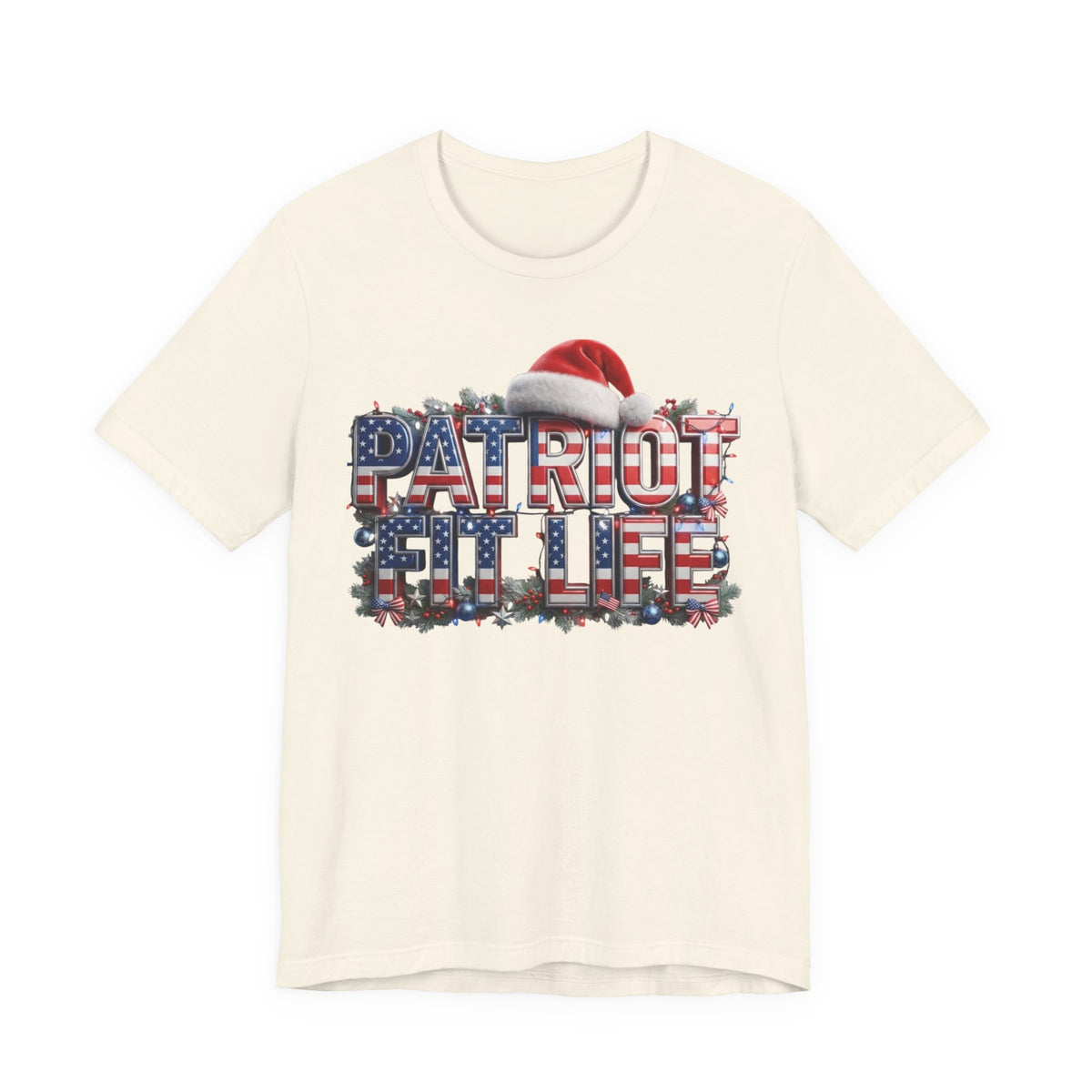 An off-white crewneck t-shirt featuring a graphic print of the words 'PATRIOT FIT LIFE' filled with an American flag pattern, topped with a red and white Santa hat, shown against a plain white background.