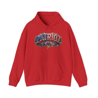 A red pullover hoodie with a Christmas festive chest graphic spelling 'PATRIOT' using American flags and green holly leaves, shown against a plain white background.
