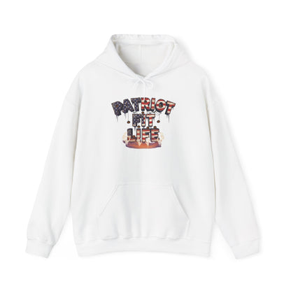 A white pullover hoodie with a graphic on the chest that reads 'PATRIOT FIT LIFE' with an American flag-colored pattern text in a dripping, graffiti-style font. The graphic features red, orange, and black tones with mini pumpkins.
