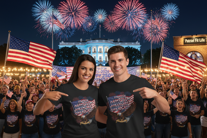 Two people in front of a crowd wearing black t-shirts that say 1776-2026 Happy 250th Birthday America!!! with American flags and fireworks, with the White House in the background.