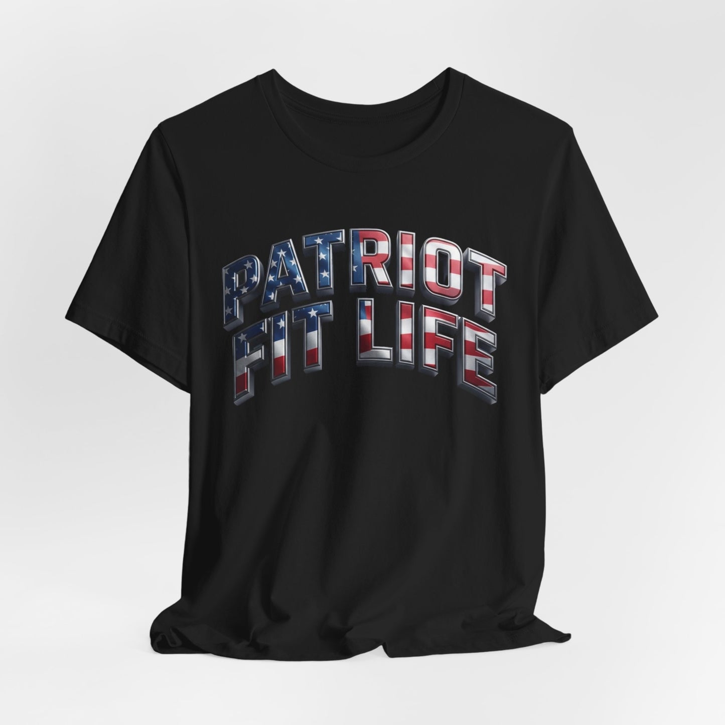 A black short-sleeve t-shirt with 'PATRIOT FIT LIFE' printed across the chest in a 3D block font filled with an American flag pattern of red, white, and blue, shown on a light gray background.