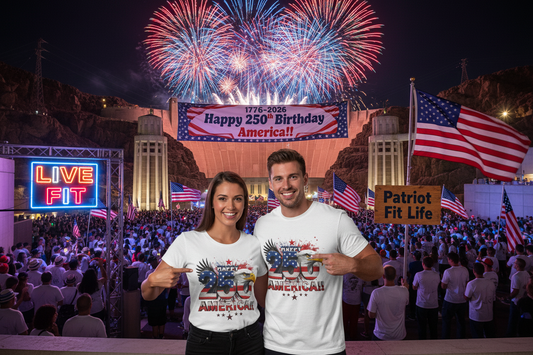 Two people wearing white. Happy 250 America!! shirts in front of a large crowd at the Hoover Dam with fireworks and American flags.