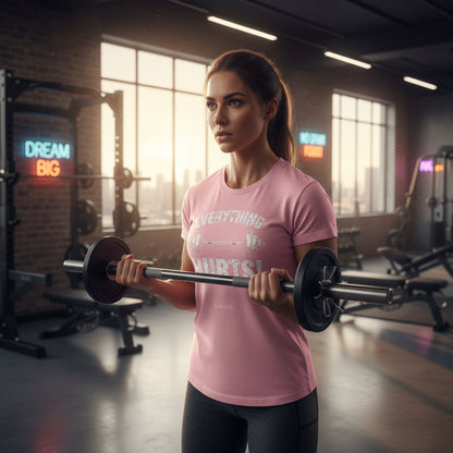 Pink t-shirt with 'Everything Hurts!' GYM LIFE text in an indoor gym background.