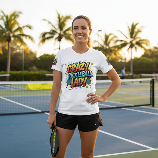 Woman on a pickleball court wearing a 'Crazy Pickleball Lady' design shirt.