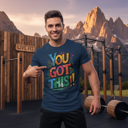 A man wearing a motivational t-shirt You Got This!! in an outdoor gym setting with mountains in the background.