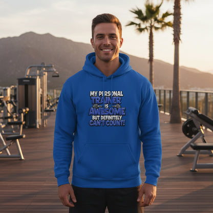 Man wearing a blue hoodie with text in an outdoor setting with mountains and palm trees.