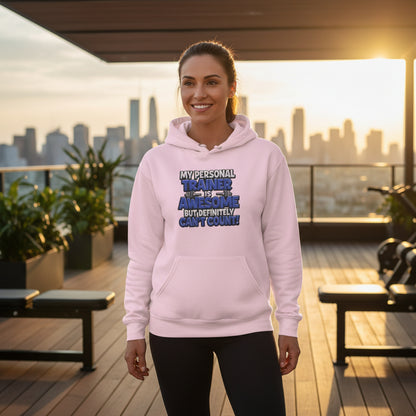 Pink hoodie with text in a gym setting.