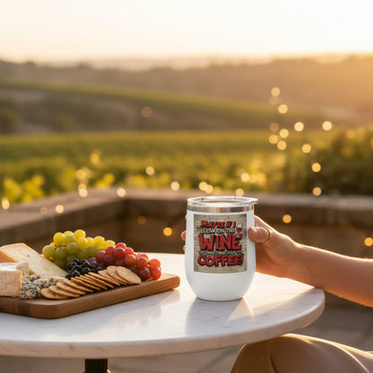 Person holding a wine tumbler that says Maybe If I Blow On This Wine They Will Think That It Is Coffee!, with a scenic vineyard background