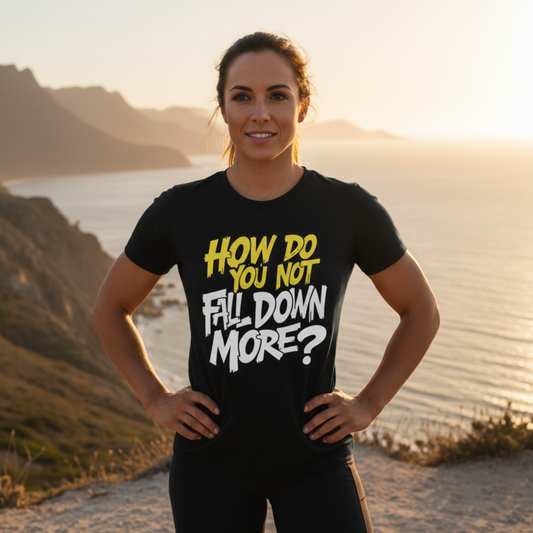 Woman wearing a black t-shirt with a motivational quote at sunset by the beach