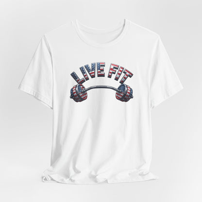 A white short-sleeve crewneck t-shirt with a graphic on the chest featuring the text 'LIVE FIT' in an American flag pattern above a barbell with matching flag-patterned weight plates.