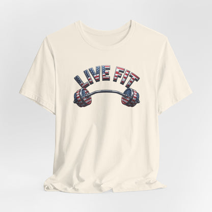 An off-white crewneck t-shirt featuring a graphic of a barbell with an American flag pattern and the text 'LIVE FIT' in matching flag-styled letters.
