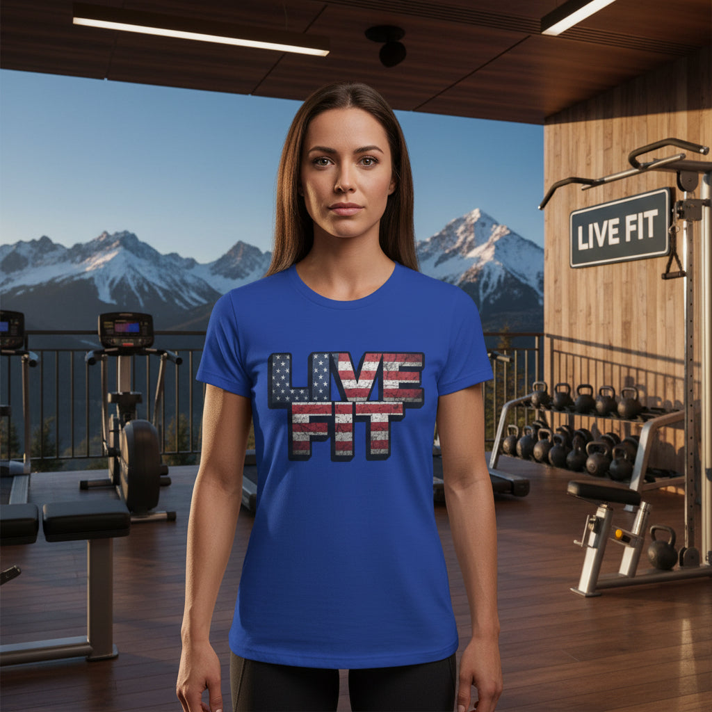 Woman wearing a blue 'LIVE FIT' t-shirt in a gym with mountain view.