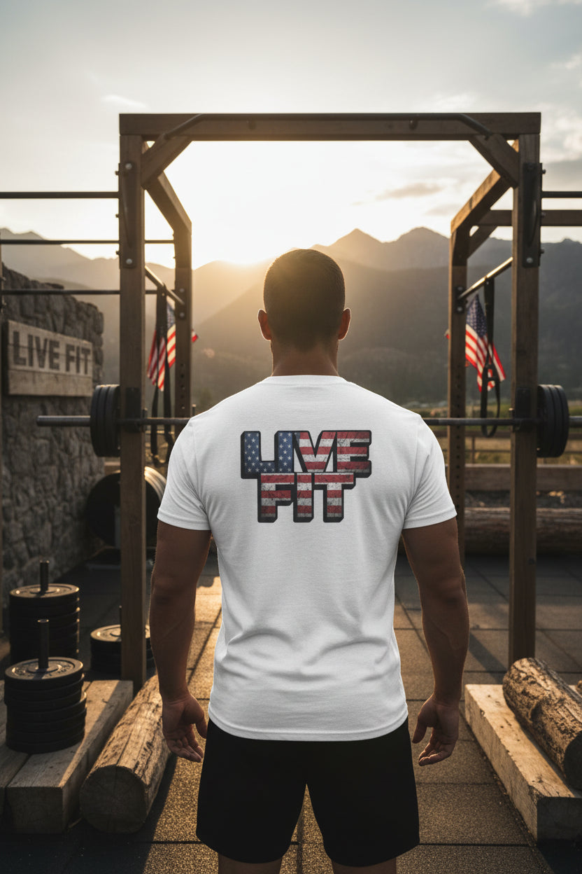 Person wearing a 'Live Fit' t-shirt in an outdoor fitness setting with mountains in the background.