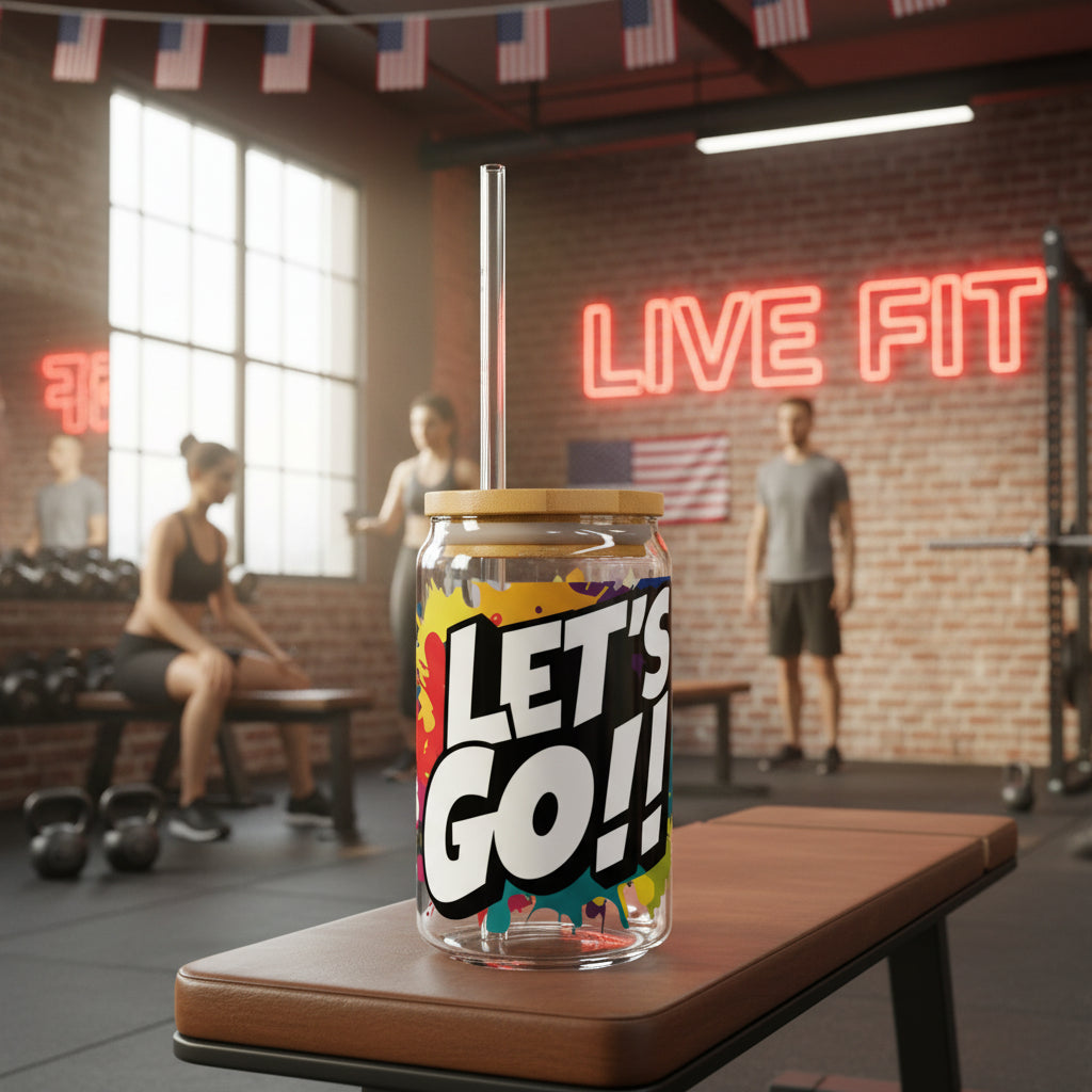 Glass tumbler with 'LET'S GO!!' text in a gym setting.