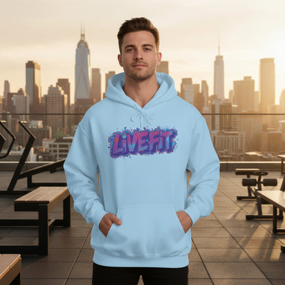 A man wearing a light blue hoodie with a 'LIVE FIT' design in front of a city skyline.