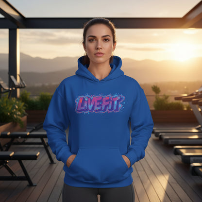 A woman wearing a blue hoodie with 'LIVE FIT' text in a gym setting.
