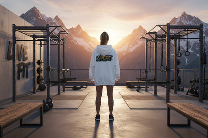 A woman wearing a white hoodie with a colorful 'LIVE FIT' logo on the back against a white background.