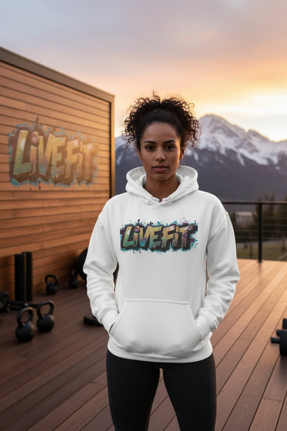 Person wearing a white hoodie with 'LIVE FIT' text in a gym setting.