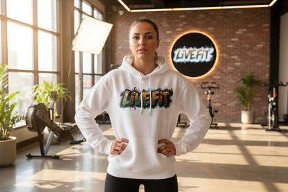 A woman wearing a white hoodie with a colorful 'LIVE Fit' logo in a gym setting.