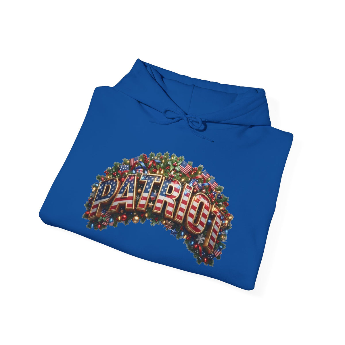 A royal blue folded hoodie with a festive graphic on the front. The graphic features the word 'PATRIOT' in 3D red, white, and blue lettering, surrounded by a wreath of Christmas trees, ornaments, and lights.