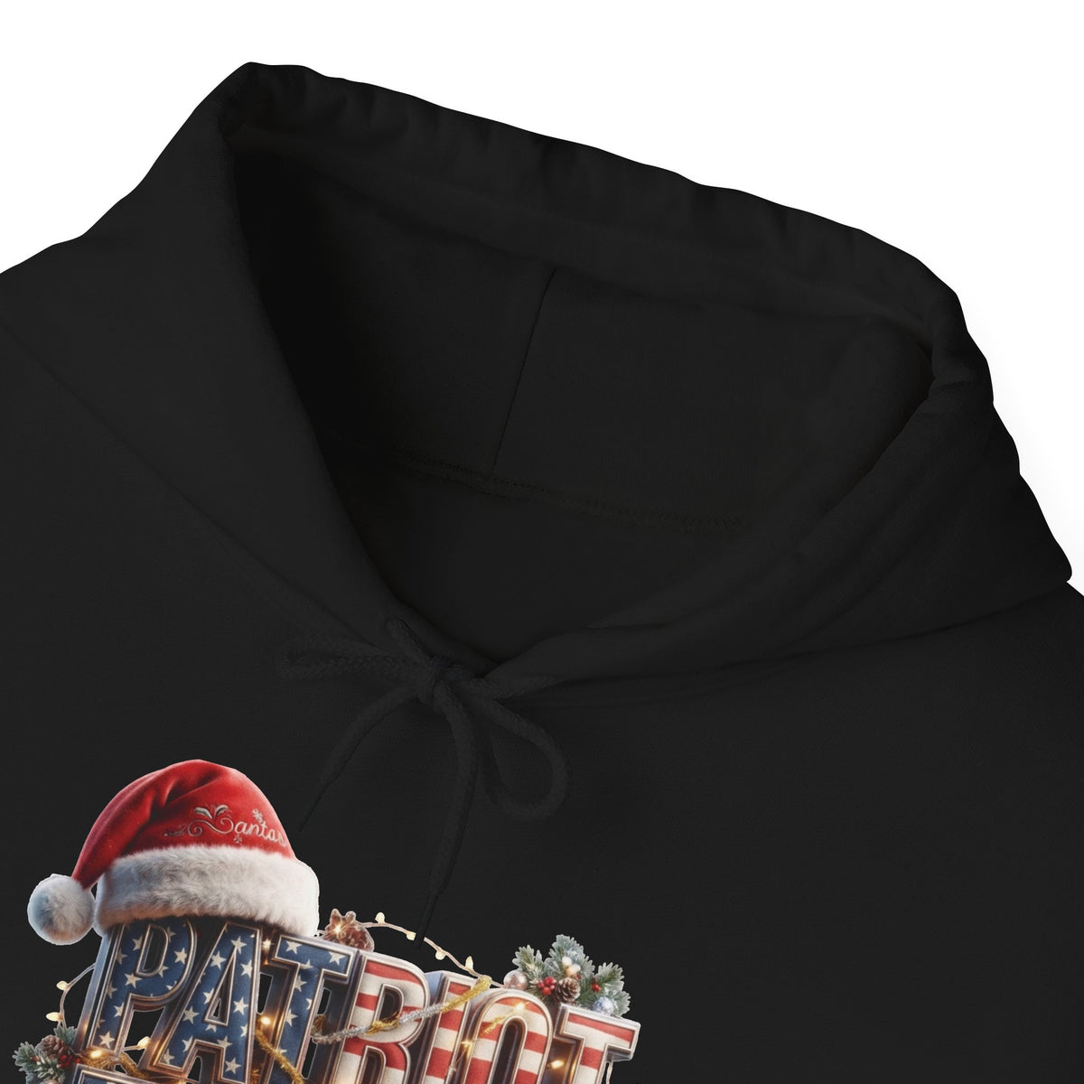 Close-up of a black hoodie with a festive graphic at the lower left showing a red Santa hat and the word 'PATRIOT' in red, white, and blue lettering.