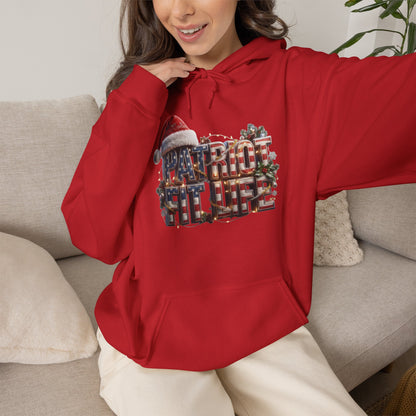 A woman wearing a bright red pullover hoodie with a large 'PATRIOT FIT LIFE' graphic on the front, sitting on a light beige couch.