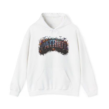 A white pullover hoodie featuring a Halloween graphic print on the chest with the word 'PATRIOT' in a 3D-effect font surrounded by pumpkins, bats, and a dark textured background.