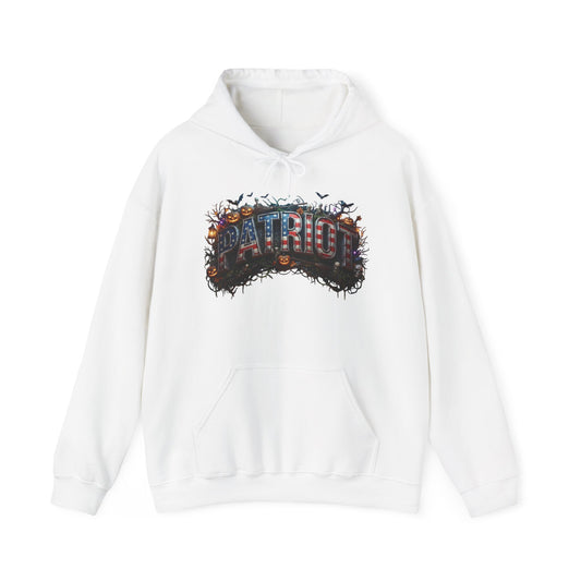 A white pullover hoodie featuring a Halloween graphic print on the chest with the word 'PATRIOT' in a 3D-effect font surrounded by pumpkins, bats, and a dark textured background.