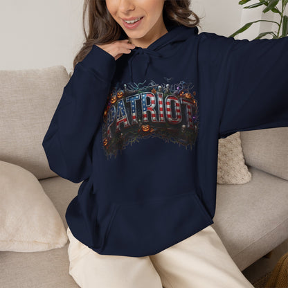 A person wearing a navy blue hoodie with 'PATRIOT' design is sitting on a beige couch.