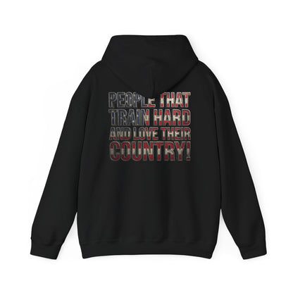 A black pullover hoodie shown from the back, featuring a graphic text print that reads 'PEOPLE THAT TRAIN HARD AND LOVE THEIR COUNTRY!' in a distressed red, white, and blue American flag pattern.