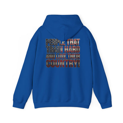 A royal blue hoodie shown from the back, featuring a large graphic text print that reads 'PEOPLE THAT TRAIN HARD AND LOVE THEIR COUNTRY!' in a distressed, patriotic red, white, and blue patterned font.