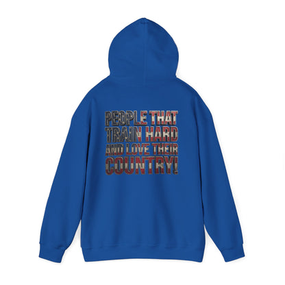 A royal blue hoodie shown from the back, featuring a distressed text graphic that reads 'PEOPLE THAT TRAIN HARD AND LOVE THEIR COUNTRY!' in red, white, and blue.