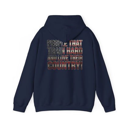 A black pullover hoodie shown from the back, featuring a graphic text print that reads 'PEOPLE THAT TRAIN HARD AND LOVE THEIR COUNTRY!' in a distressed red, white, and blue American flag pattern.