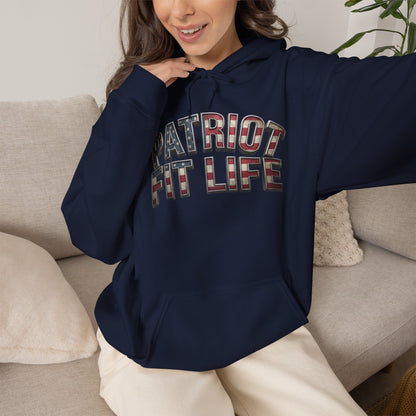 A woman wearing a navy blue hoodie with 'PATRIOT FIT LIFE' printed across the chest in an American flag pattern, sitting on a light beige couch.