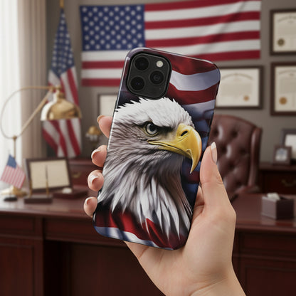 A phone case with an American flag and bald eagle design held in front of a room with American flags.
