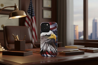 Phone case with an American flag and bald eagle design on a desk in an office setting.