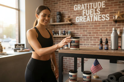 Candle jar with American flag design and 'BLESSED' text.