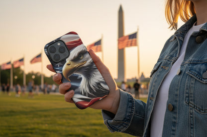 A female holding a phone case with an eagle and an American flag in front of the Washington Monument.