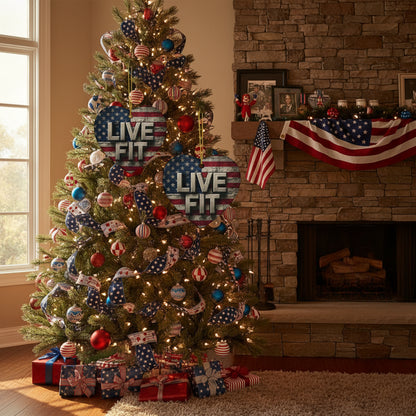Decorated Christmas tree with 'LIVE FIT' ceramic ornaments in a living room with a fireplace.