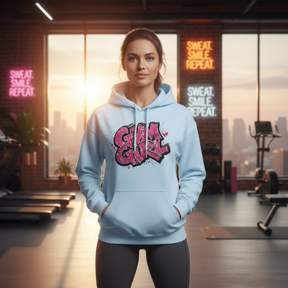 Light blue hoodie with 'Gym Girl' text in pink and black on a wooden floor in a gym setting