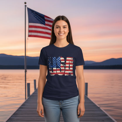 Person wearing a navy blue t-shirt with a USA American flag design in front of an American flag background.