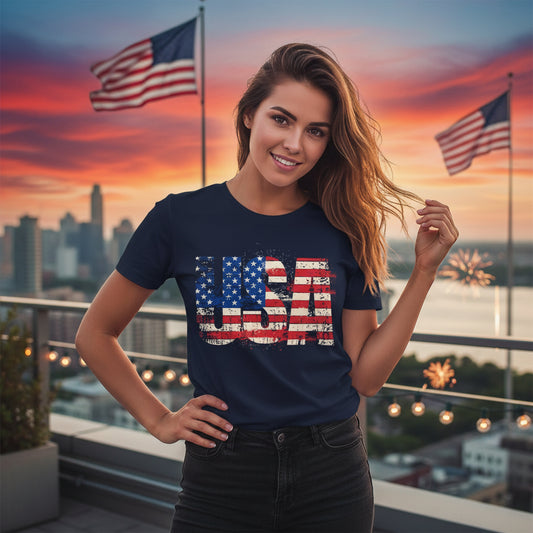 A woman wearing a navy blue t-shirt with a USA American flag design on a rooftop with American flags and city skyline in the background.