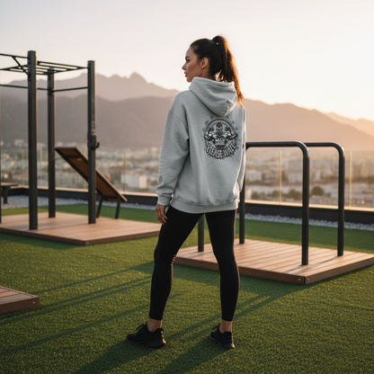 Gray hoodie with a graphic design on the back on a gray background.