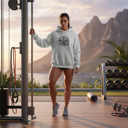 A women wearing a gray hoodie with a graphic design that says Muscles Loading Please Wait in an outdoor gym setting. 