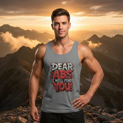 Man wearing a tank top with motivational text that says Dear Abs I Will Find You! against a mountainous landscape.