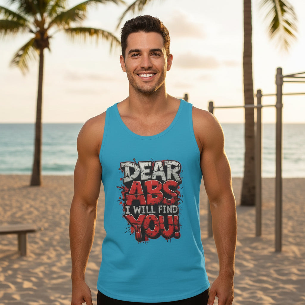 Man wearing a light blue tank top that says Dear Abs I Will Find You! in an outdoor beach setting.