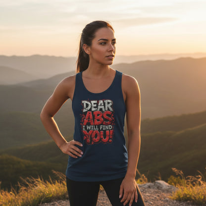 Women wearing a navy tank top with motivational text that says Dear Abs I Will Find You! in an outdoor setting.